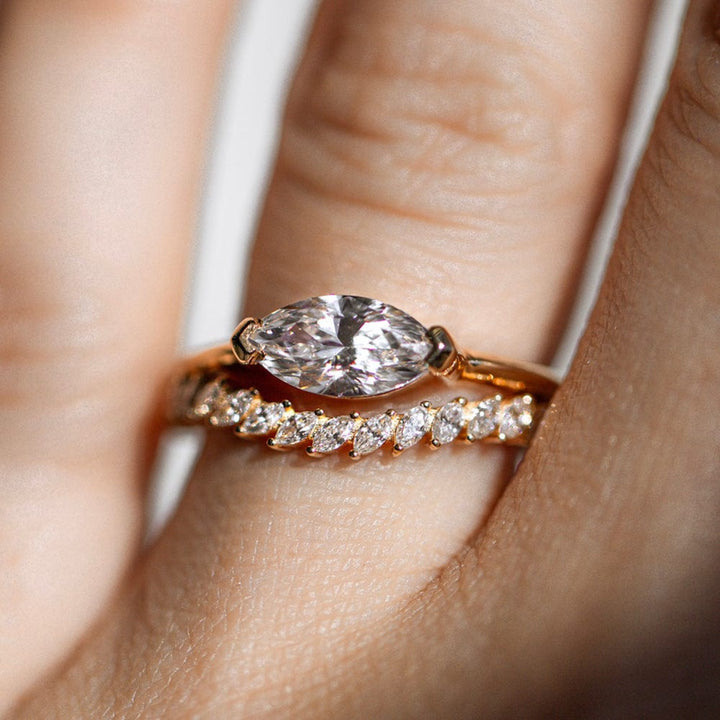East-west solitaire engagement ring with marquise cut moissanite