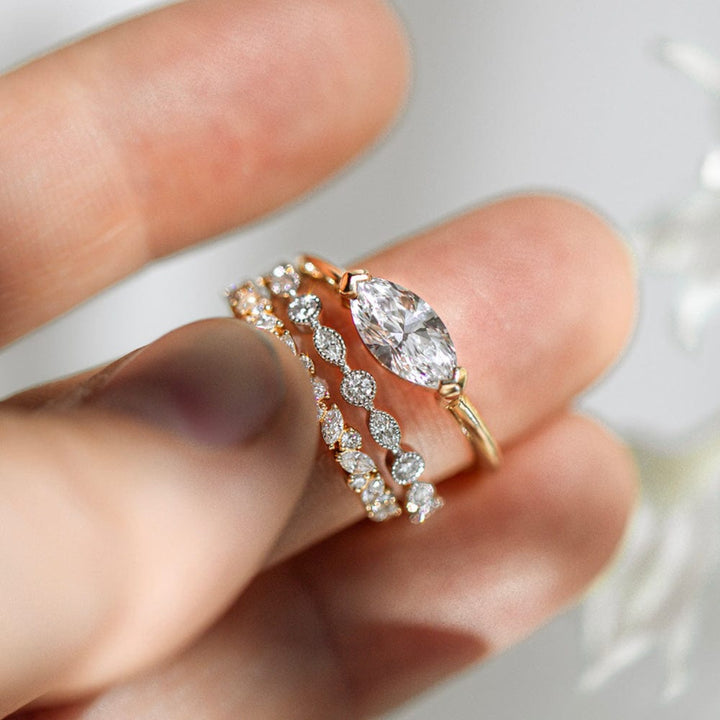 East-west solitaire engagement ring with marquise cut moissanite