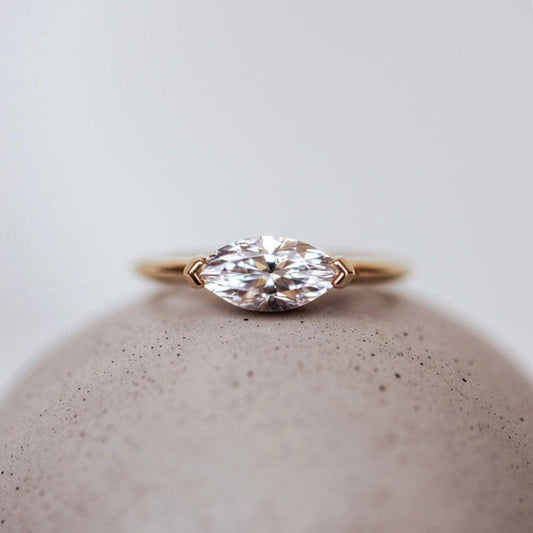 East-west solitaire engagement ring with marquise cut moissanite