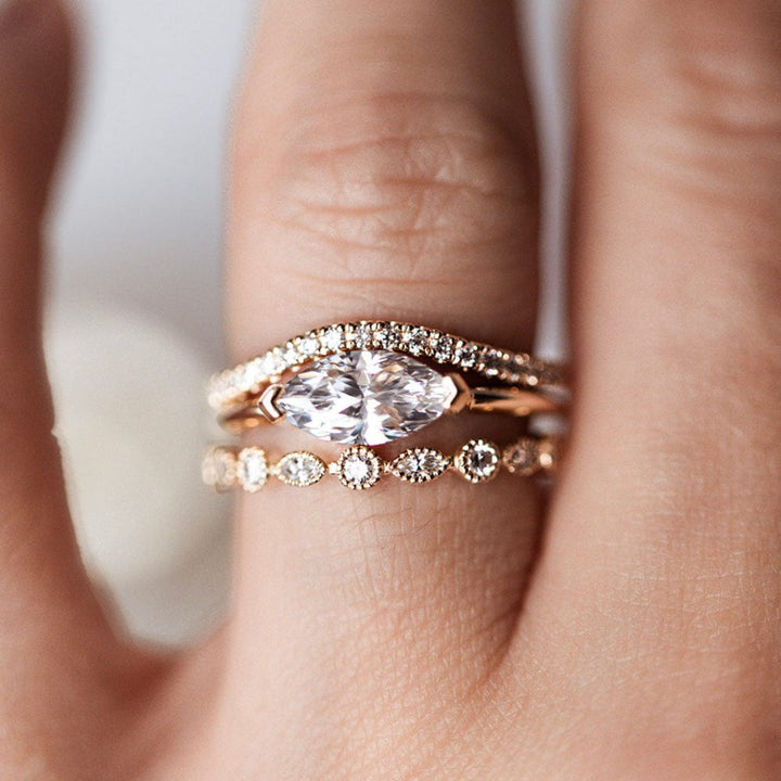 East-west solitaire engagement ring with marquise cut moissanite