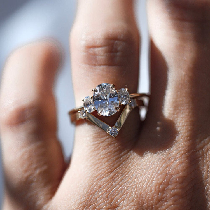 Three stone engagement ring with oval cut moissanite