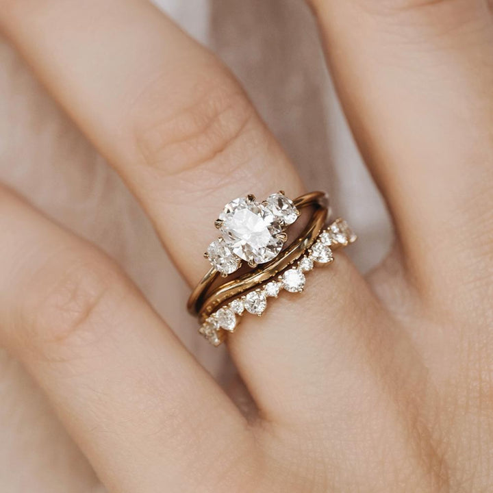 Three stone engagement ring with oval cut moissanite
