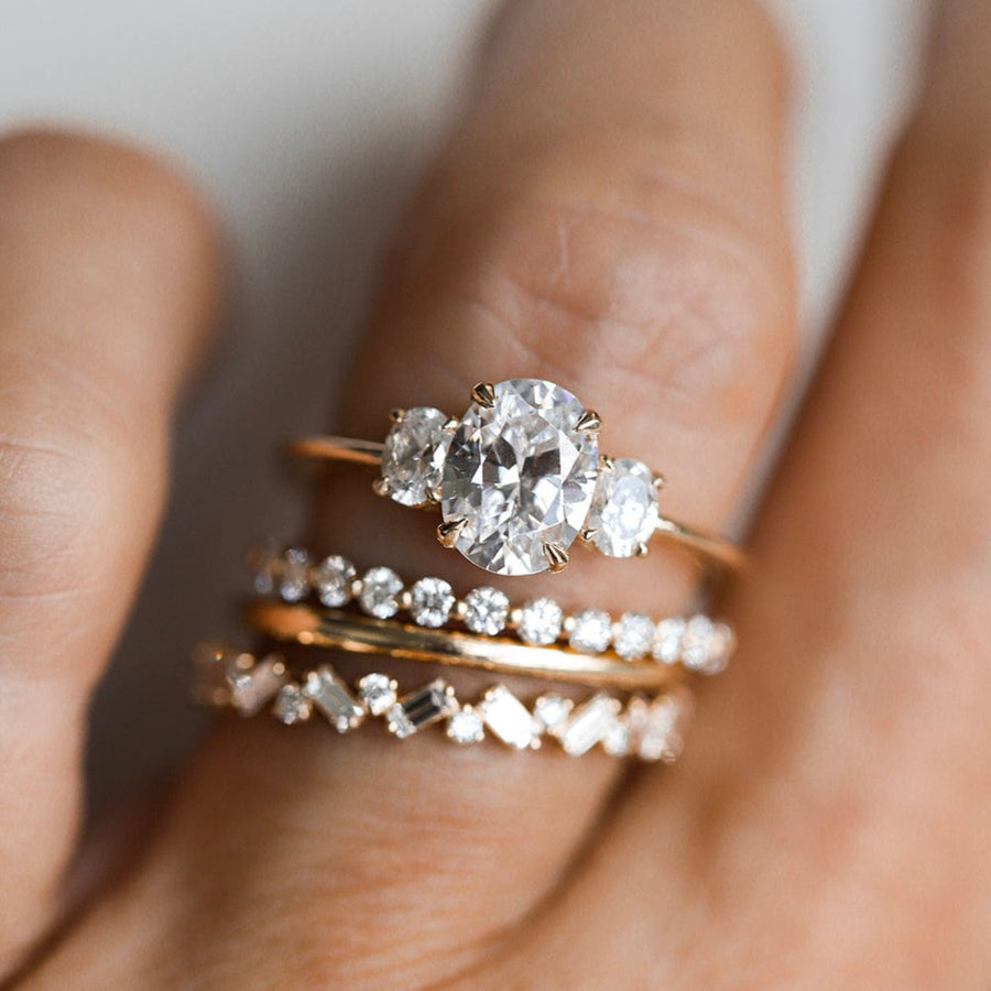 Three stone engagement ring with oval cut moissanite