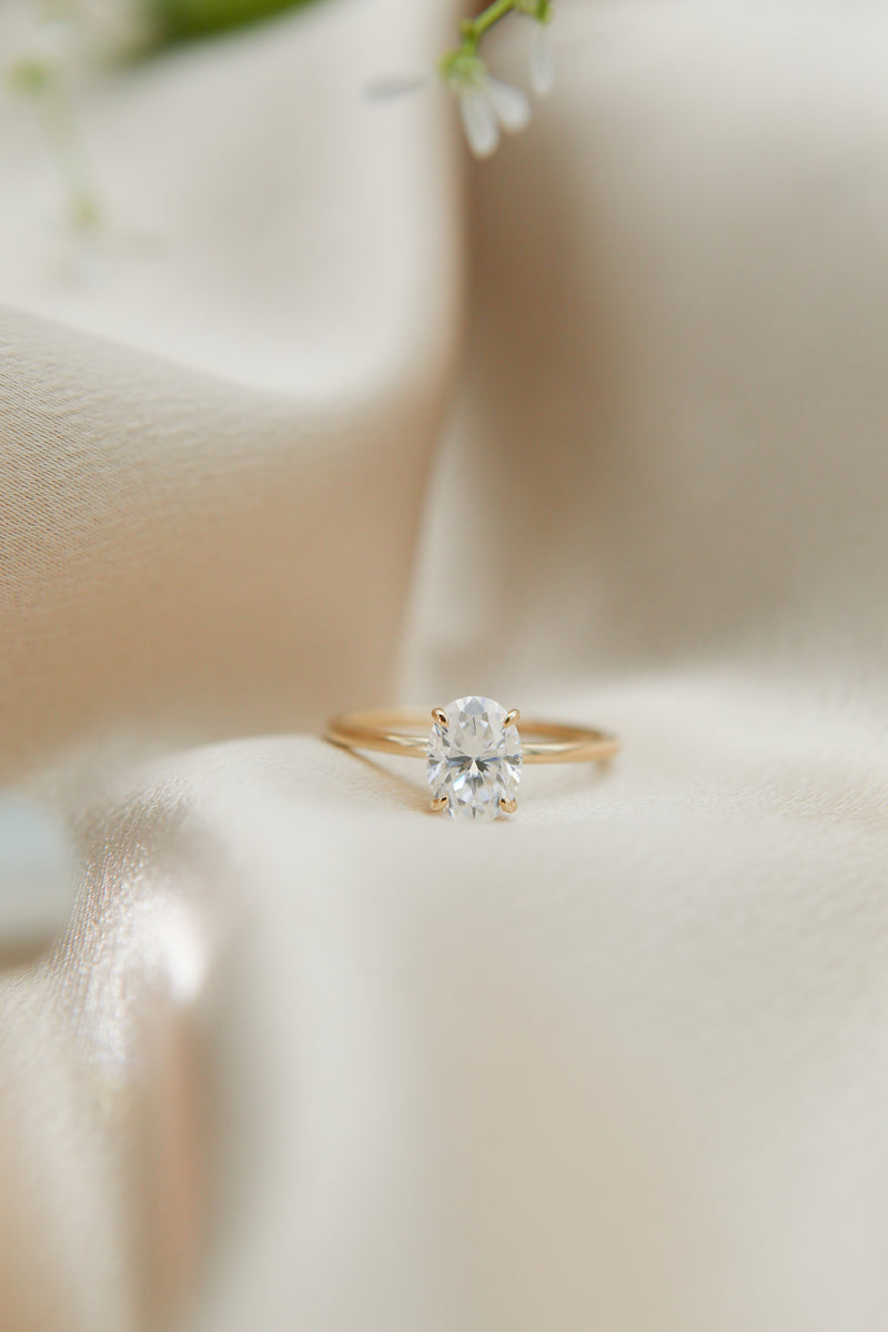 Solitaire engagement ring with oval cut moissanite stone