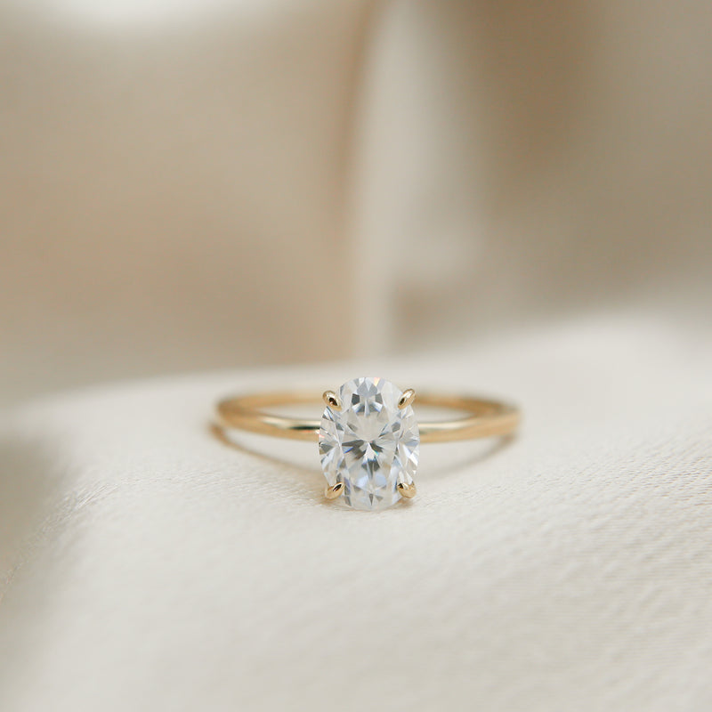 Solitaire engagement ring with oval cut moissanite stone