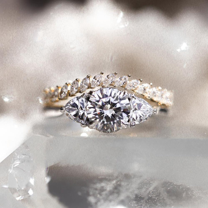 Three stone round moissanite engagement ring