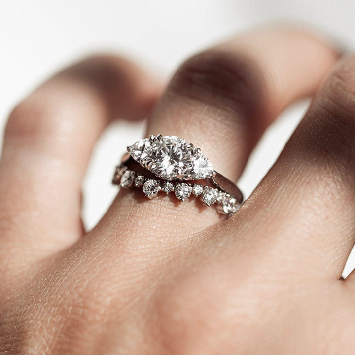 Three stone round moissanite engagement ring