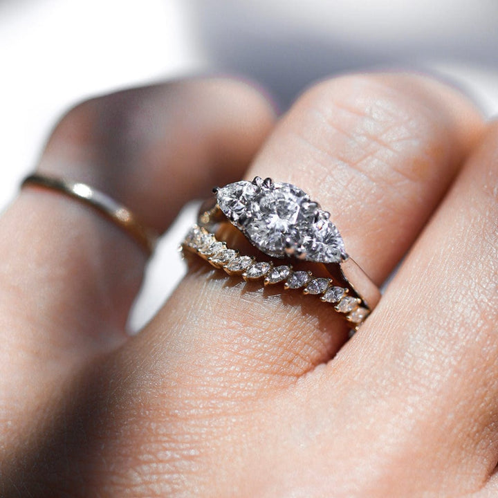 Three stone round moissanite engagement ring