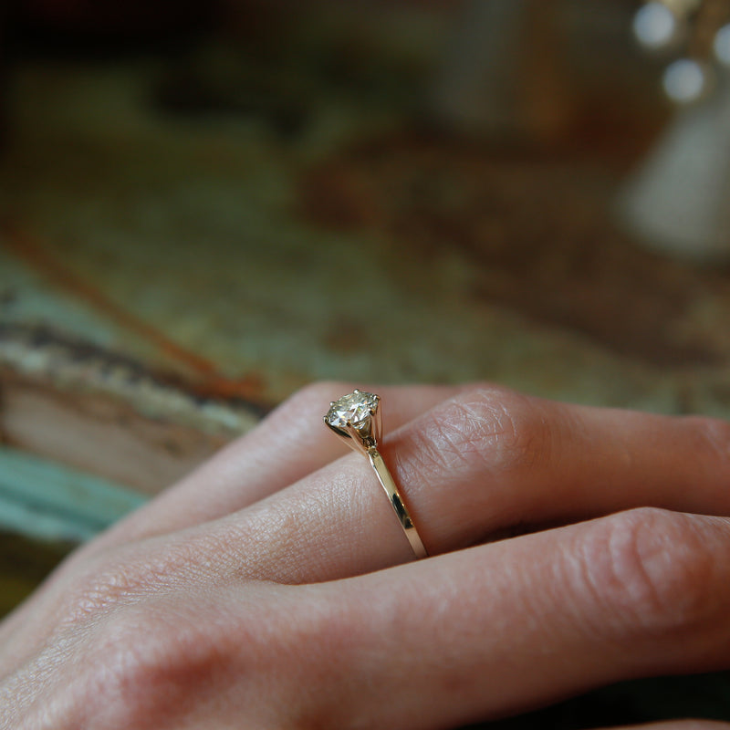 Classic solitaire engagement ring with round cut moissanite stone