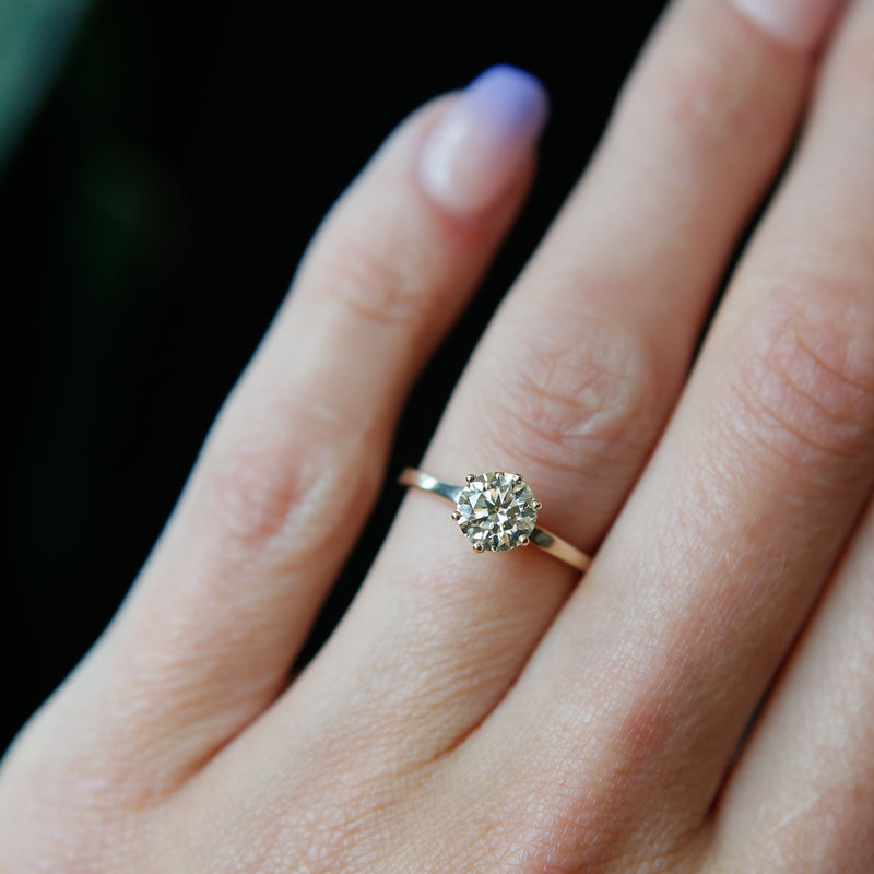 Classic solitaire engagement ring with round cut moissanite stone