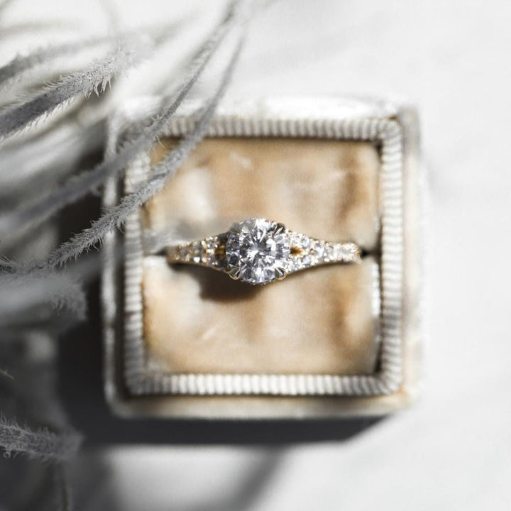Round moissanite split shank pave engagement ring with brilliant sparkle