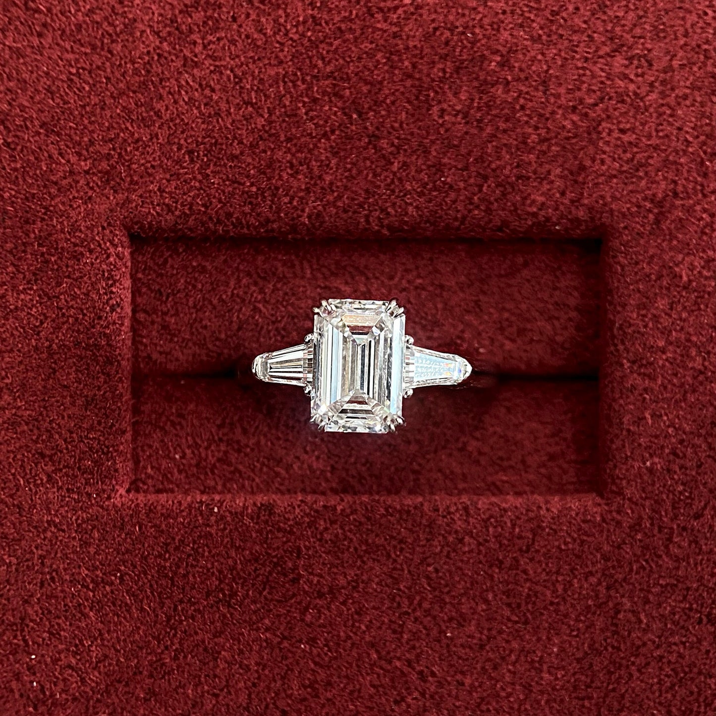 Emerald cut CVD diamond three stone engagement ring