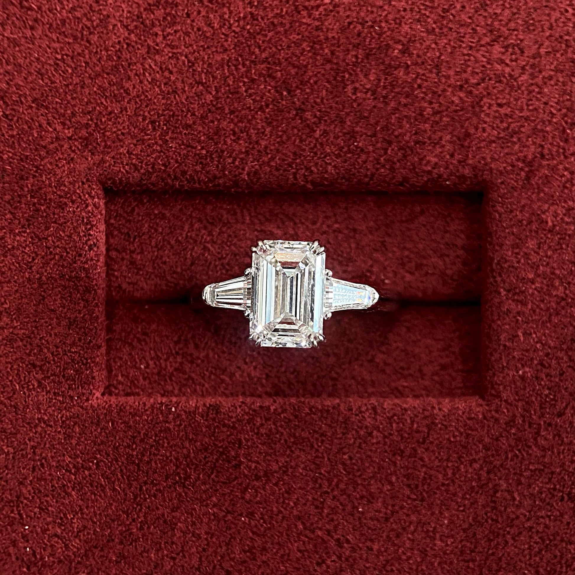 Emerald cut CVD diamond three stone engagement ring