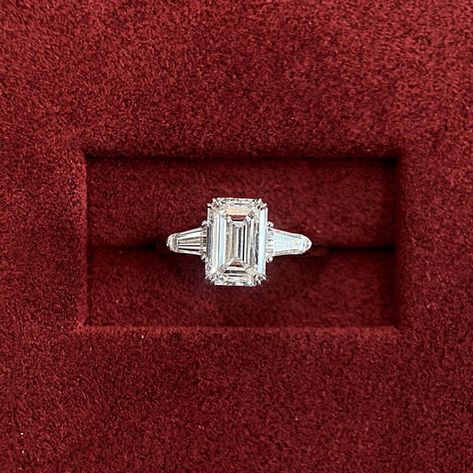 Emerald cut CVD diamond three stone engagement ring
