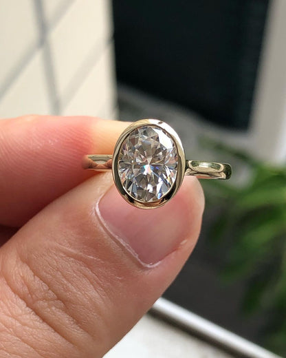 Bezel Hidden Halo Ring with 1.33 CT Oval Cut Moissanite