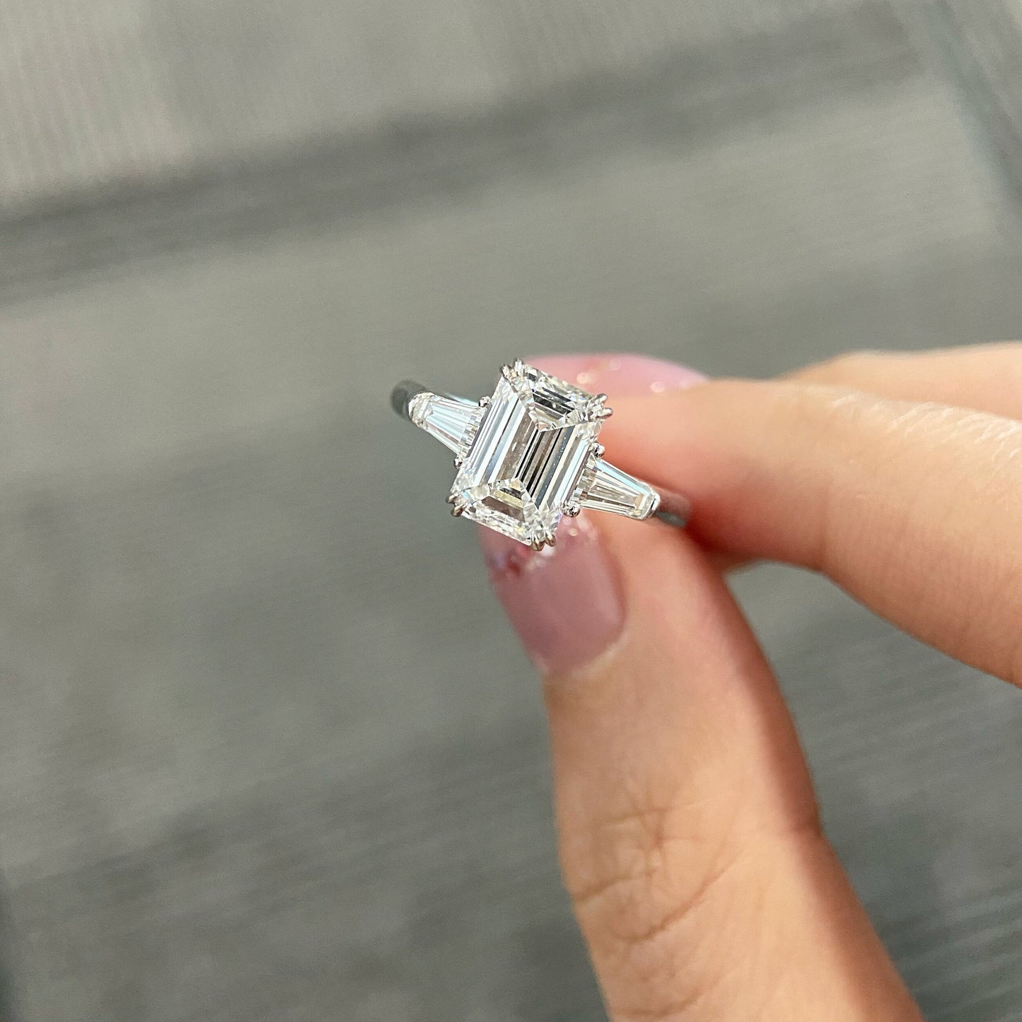Emerald cut CVD diamond three stone engagement ring