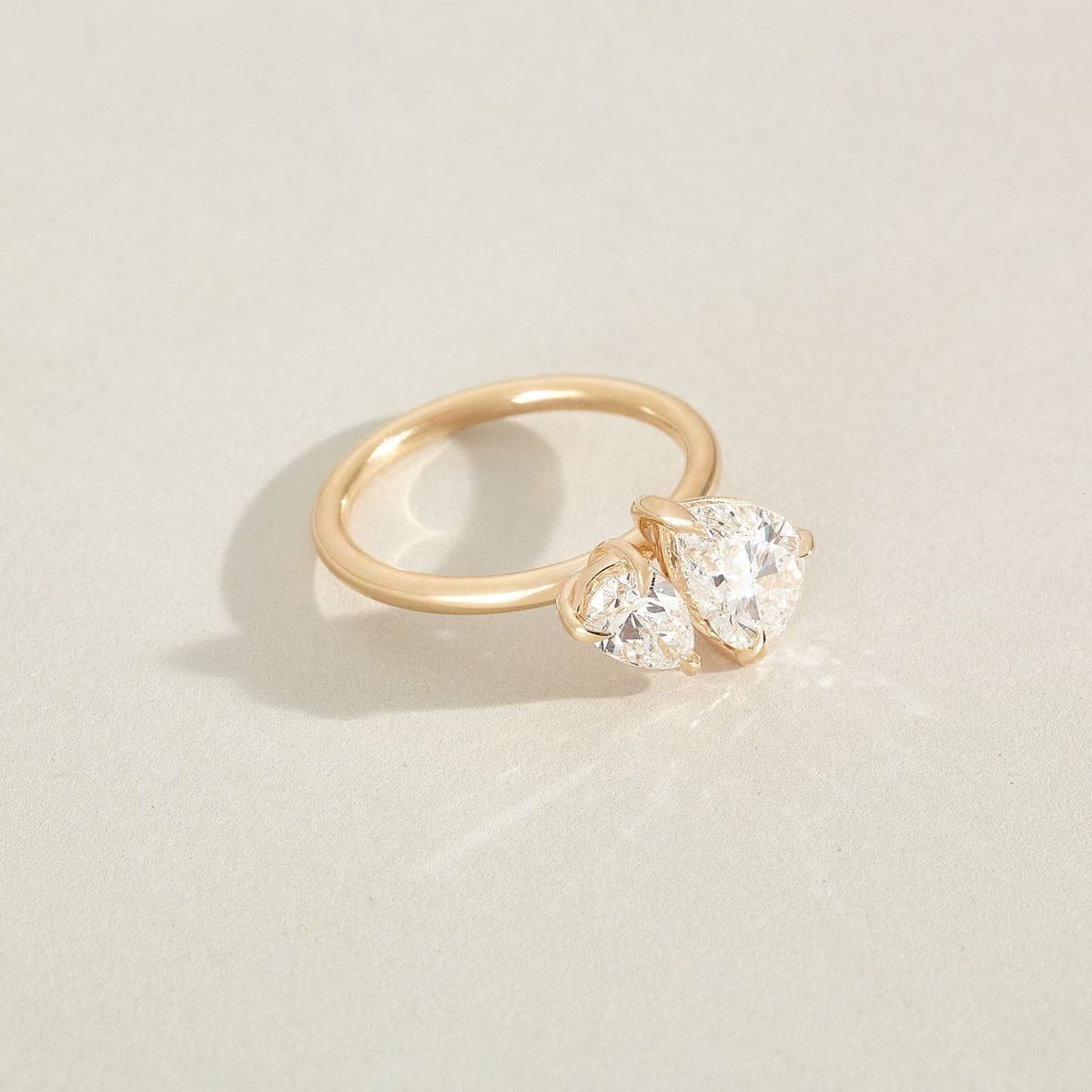 39_KateAndKole_SignatureSuite_EngagementRing_PearDuet_325_HERO_EDIT