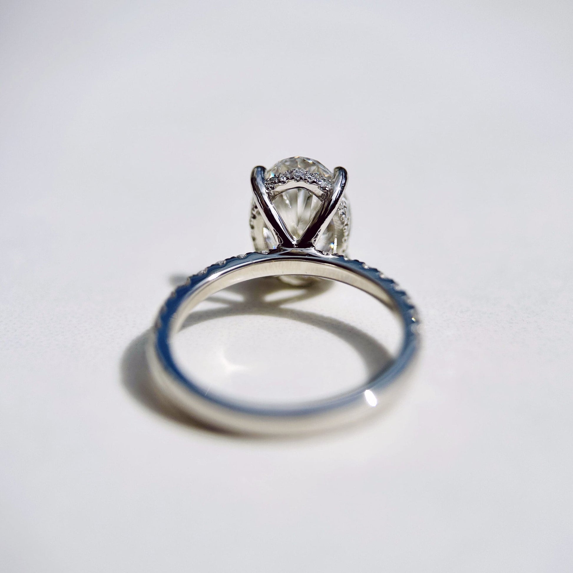 1.80 CT oval cut CVD lab grown diamond engagement ring with hidden halo, pave-set band, E color, VS1 clarity, in white gold setting