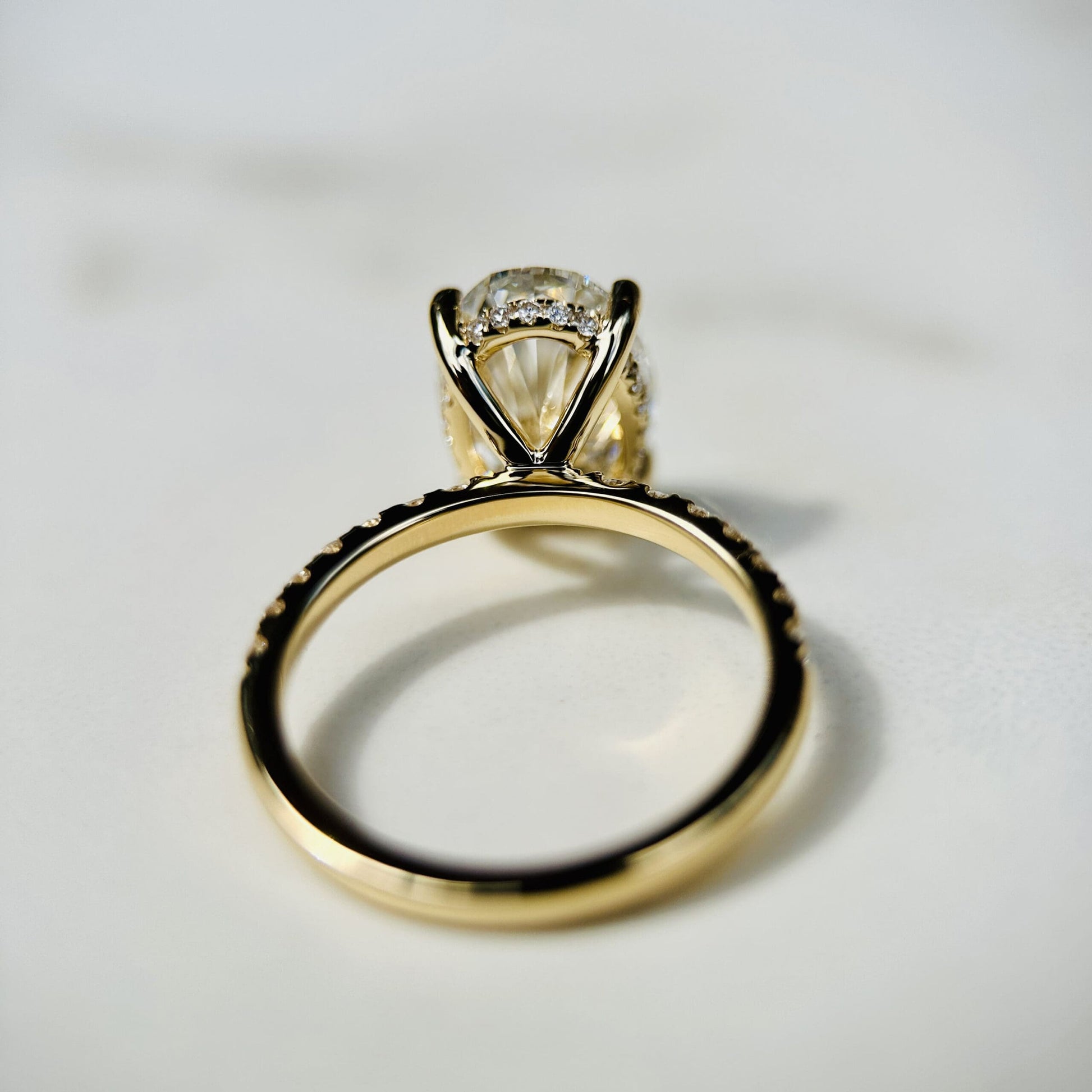 1.80 CT oval cut CVD lab grown diamond engagement ring with hidden halo, pave-set band, E color, VS1 clarity, in white gold setting