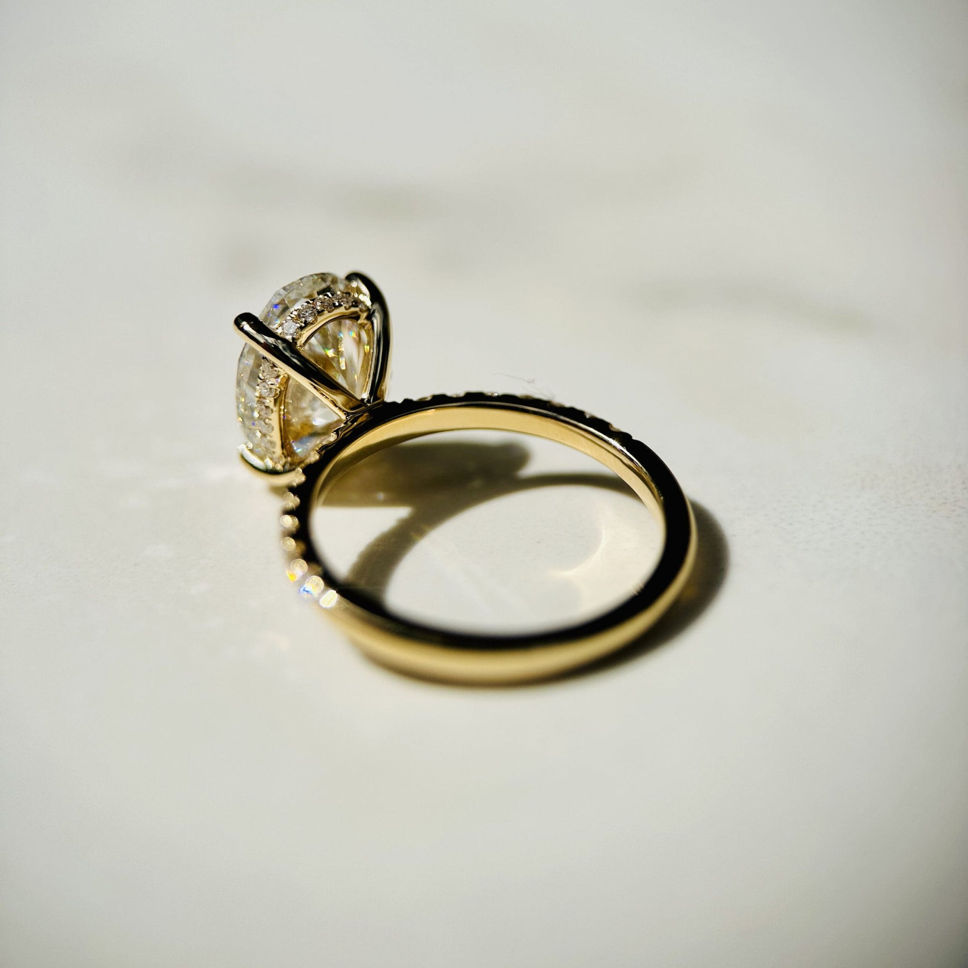 1.80 CT oval cut CVD lab grown diamond engagement ring with hidden halo, pave-set band, E color, VS1 clarity, in white gold setting