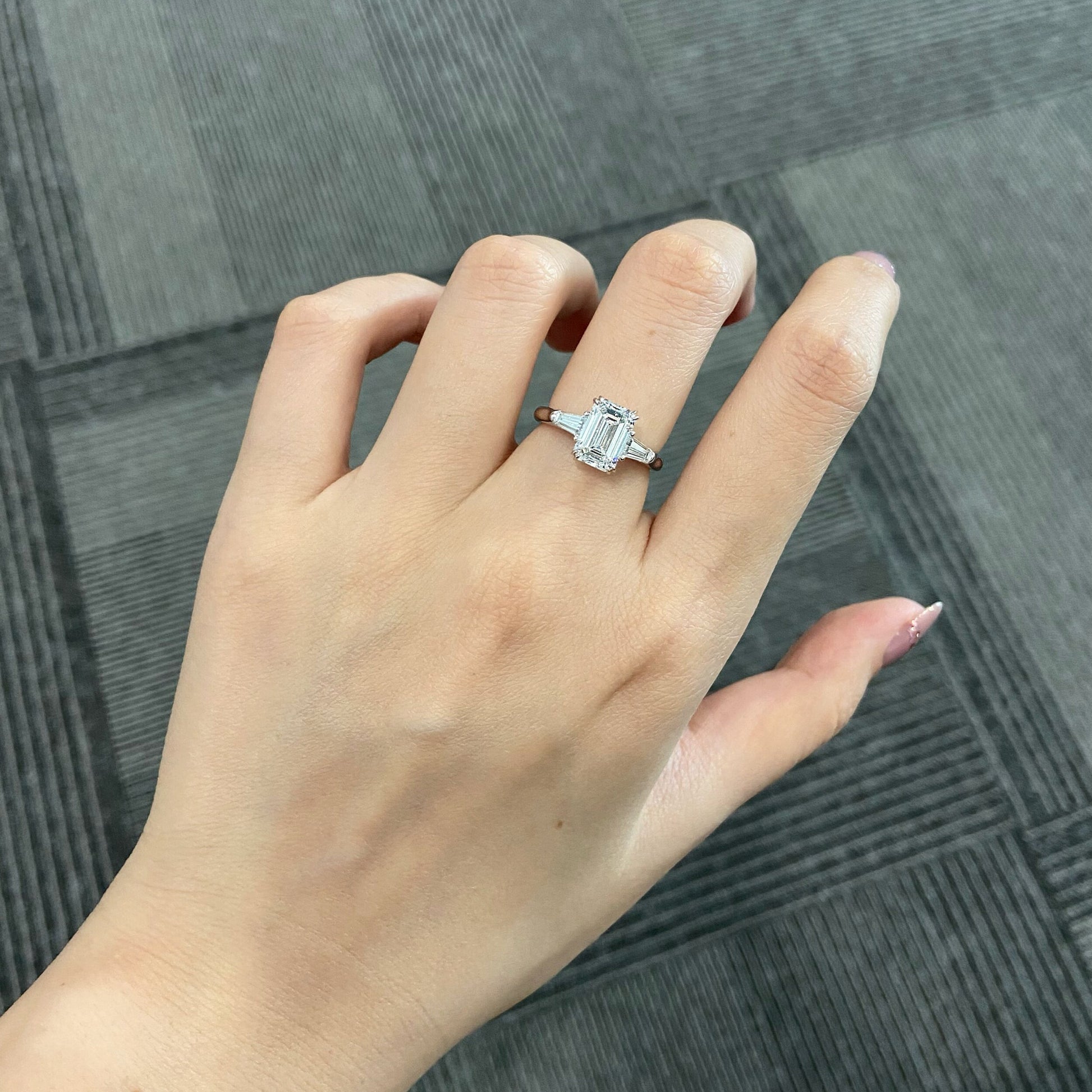 Emerald cut CVD diamond three stone engagement ring