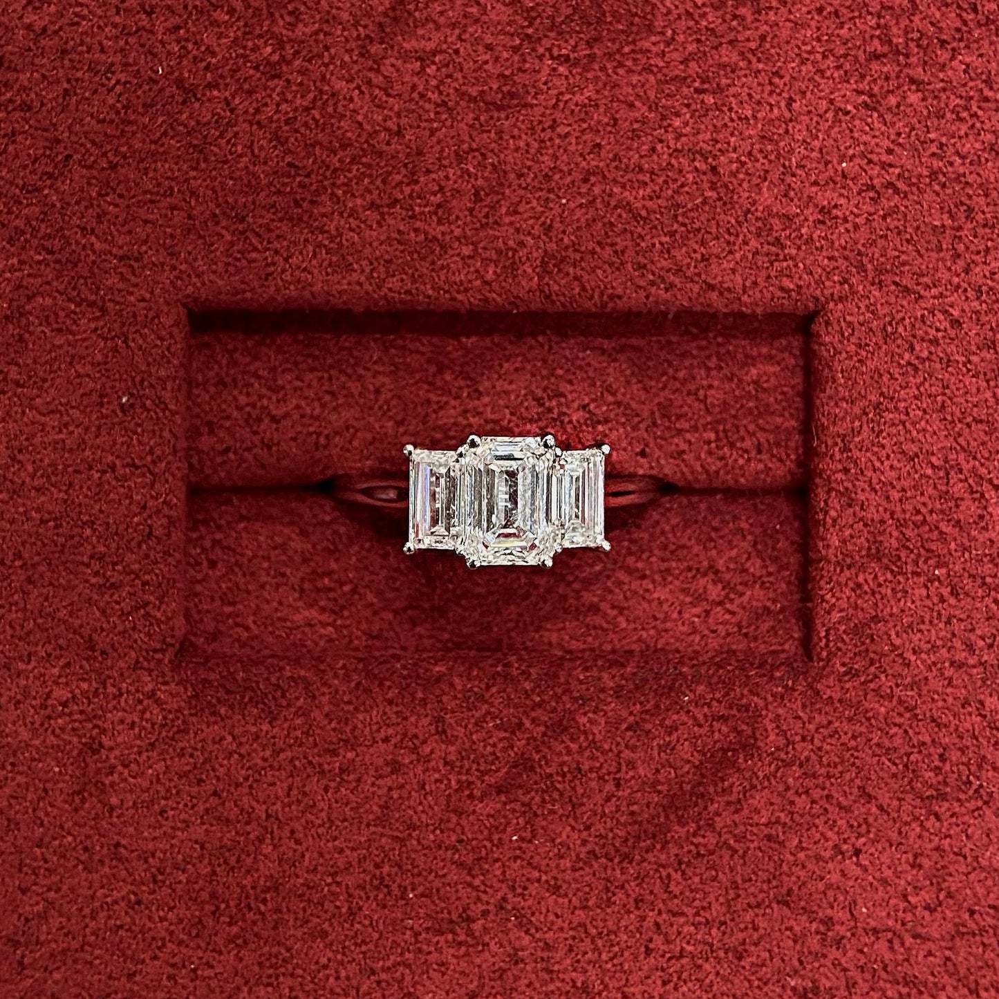 Emerald cut CVD diamond three stone engagement ring