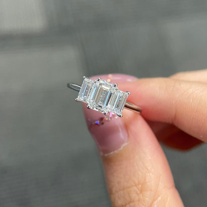 Emerald cut CVD diamond three stone engagement ring