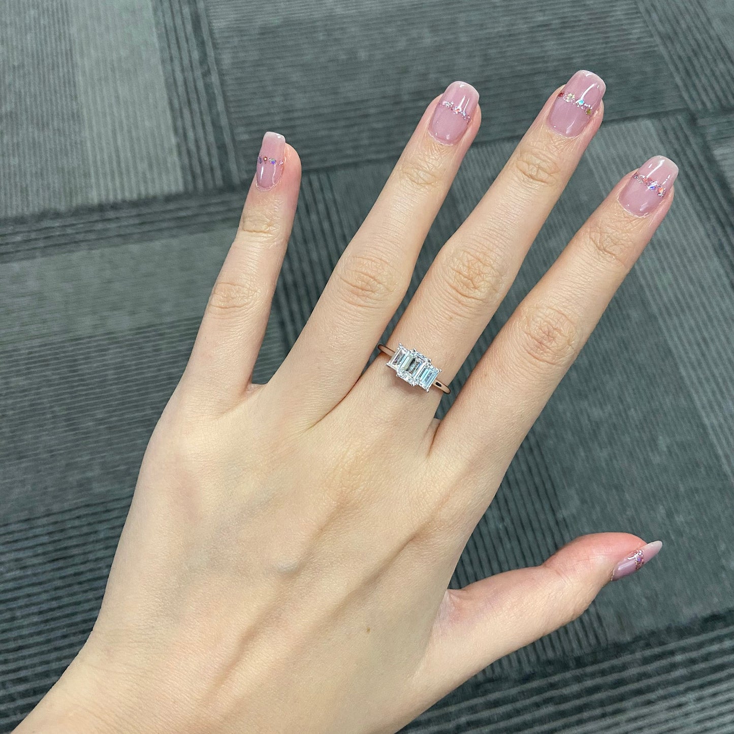 Emerald cut CVD diamond three stone engagement ring
