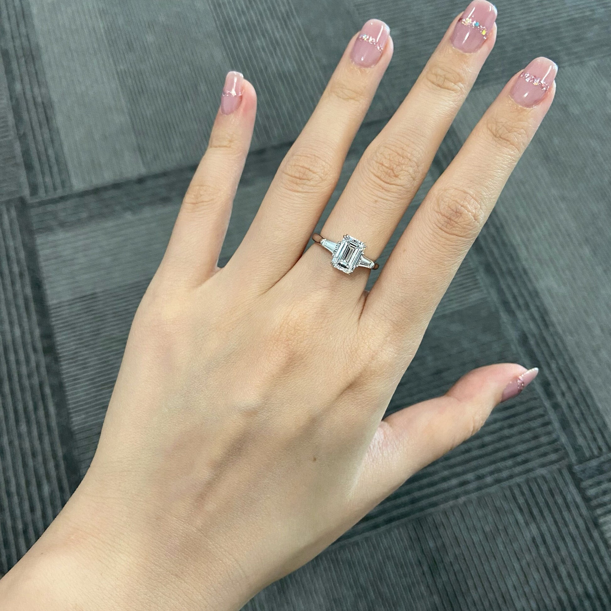 Emerald cut CVD diamond three stone engagement ring