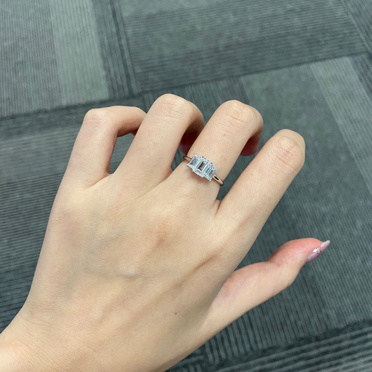 Emerald cut CVD diamond three stone engagement ring