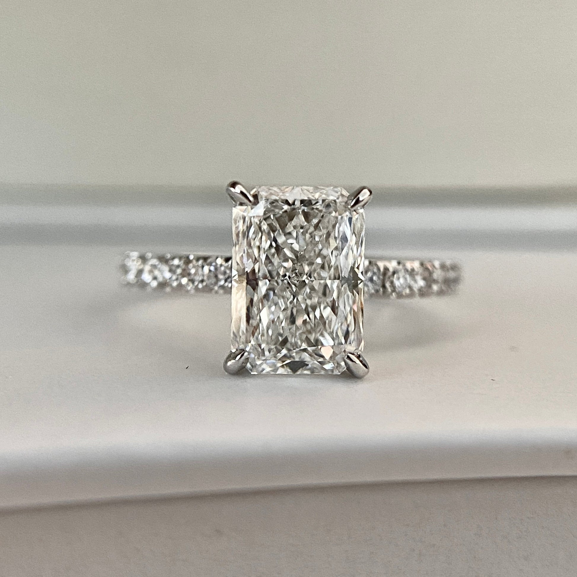 Radiant cut CVD lab grown diamond pave engagement ring with elegant sparkle