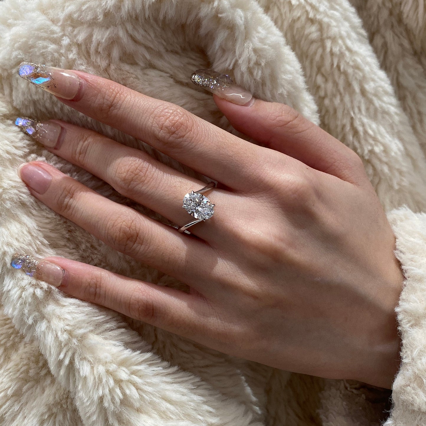 Oval cut CVD diamond bypass engagement ring with unique twist band
