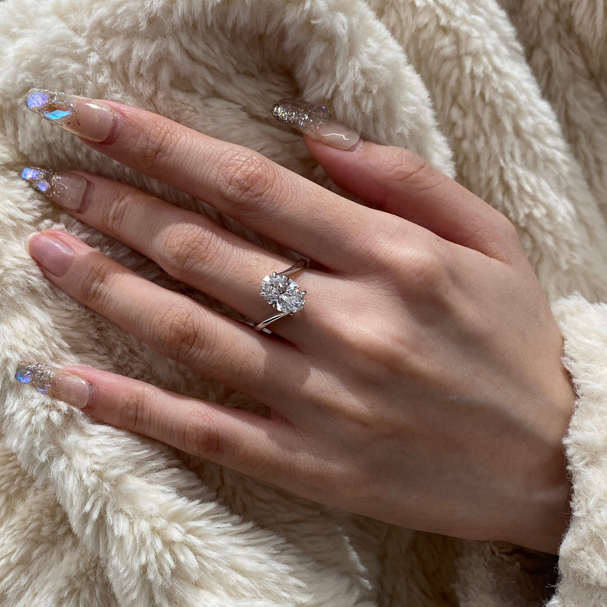 Oval cut CVD diamond bypass engagement ring with unique twist band