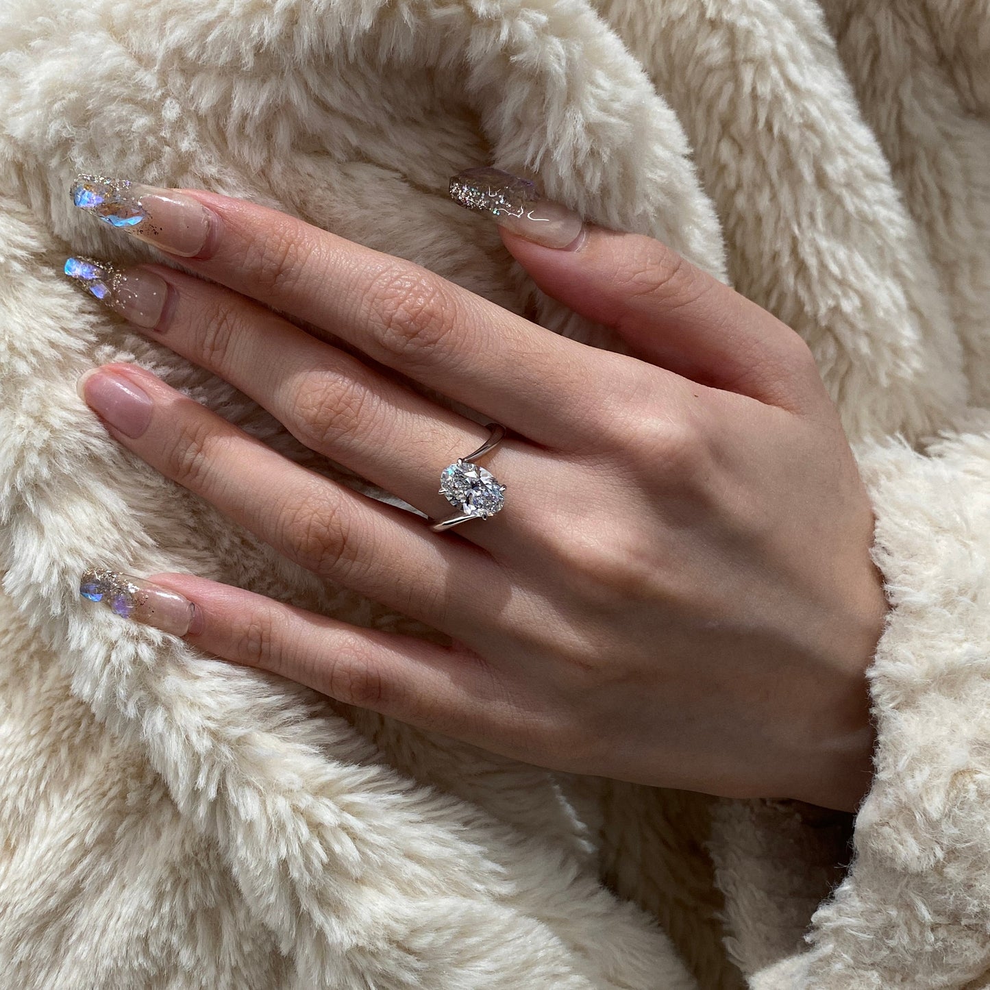Oval cut CVD diamond bypass engagement ring with unique twist band