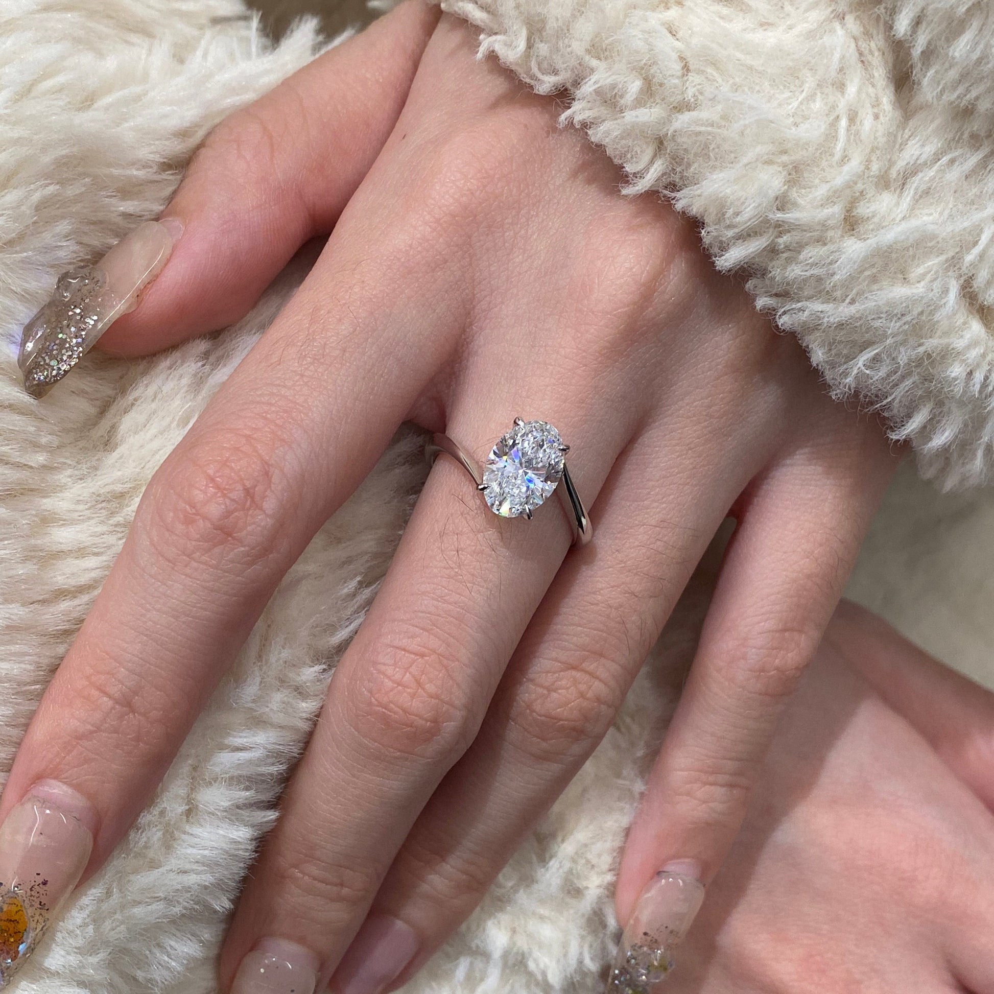 Oval cut CVD diamond bypass engagement ring with unique twist band