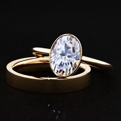 Bezel engagement ring with oval moissanite center stone