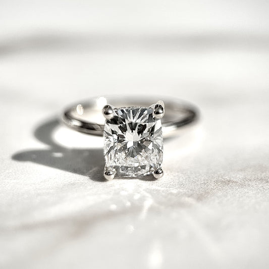 2.0 CT cushion cut CVD lab grown diamond engagement ring with hidden halo, E color, VS1 clarity, set in polished white gold