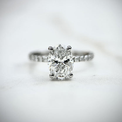 1.80 CT oval cut CVD lab grown diamond engagement ring with hidden halo, pave-set band, E color, VS1 clarity, in white gold setting