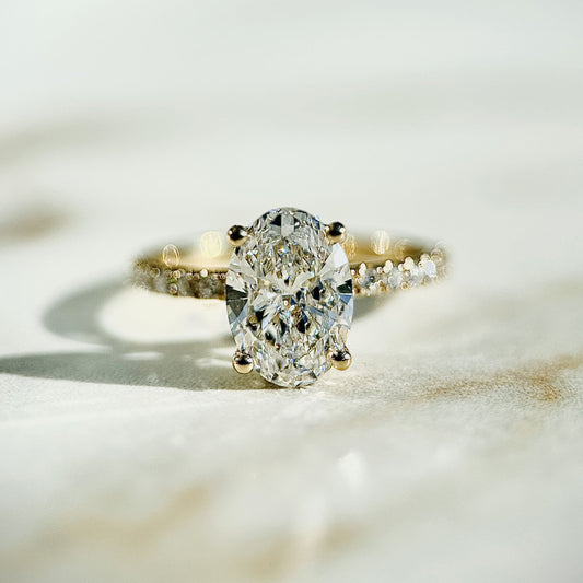 1.80 CT oval cut CVD lab grown diamond engagement ring with hidden halo, pave-set band, E color, VS1 clarity, in white gold setting