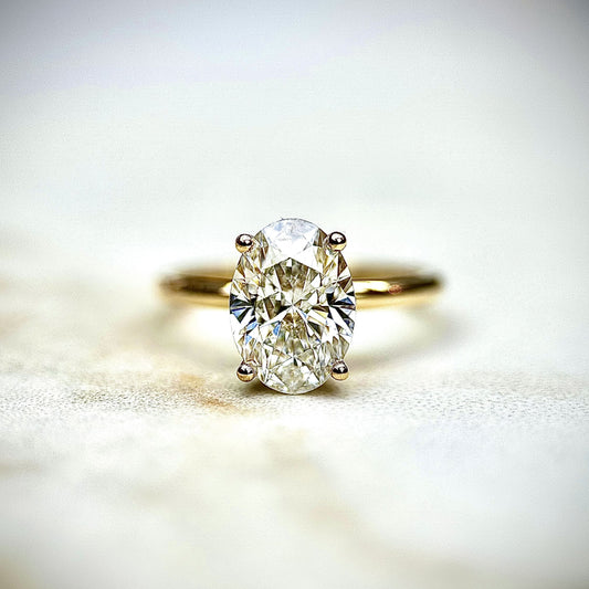 1.80 CT oval cut CVD lab grown diamond solitaire engagement ring with E color, VS1 clarity, in white gold with classic prong setting