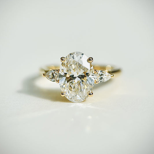 Oval cut CVD lab grown diamond three stone engagement ring with timeless elegance