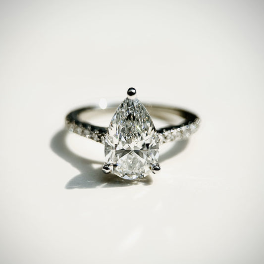 Pear cut CVD lab grown diamond pave engagement ring with timeless sparkle