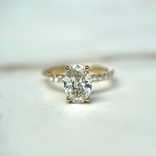 1.50 CT oval cut CVD lab grown diamond engagement ring with hidden halo, pave-set band, E color, VS1 clarity, in white gold