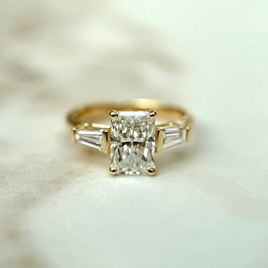 1.50 CT radiant cut CVD lab grown diamond three stone engagement ring with E color, VS1 clarity, in classic white gold prong setting