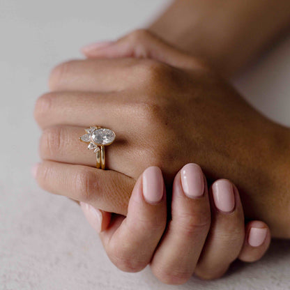 Bezel engagement ring with oval moissanite center stone