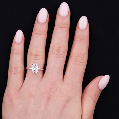 Solitaire engagement ring with cushion-cut moissanite center stone