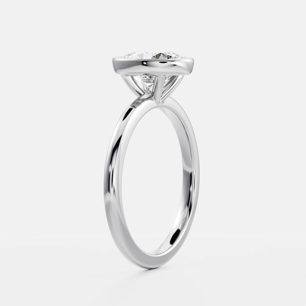 Bezel engagement ring with oval moissanite center stone