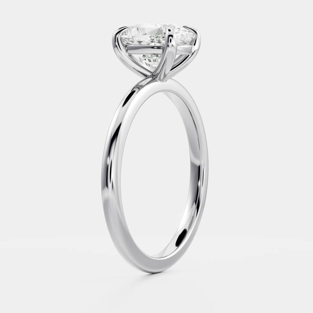 Solitaire engagement ring with cushion-cut moissanite center stone