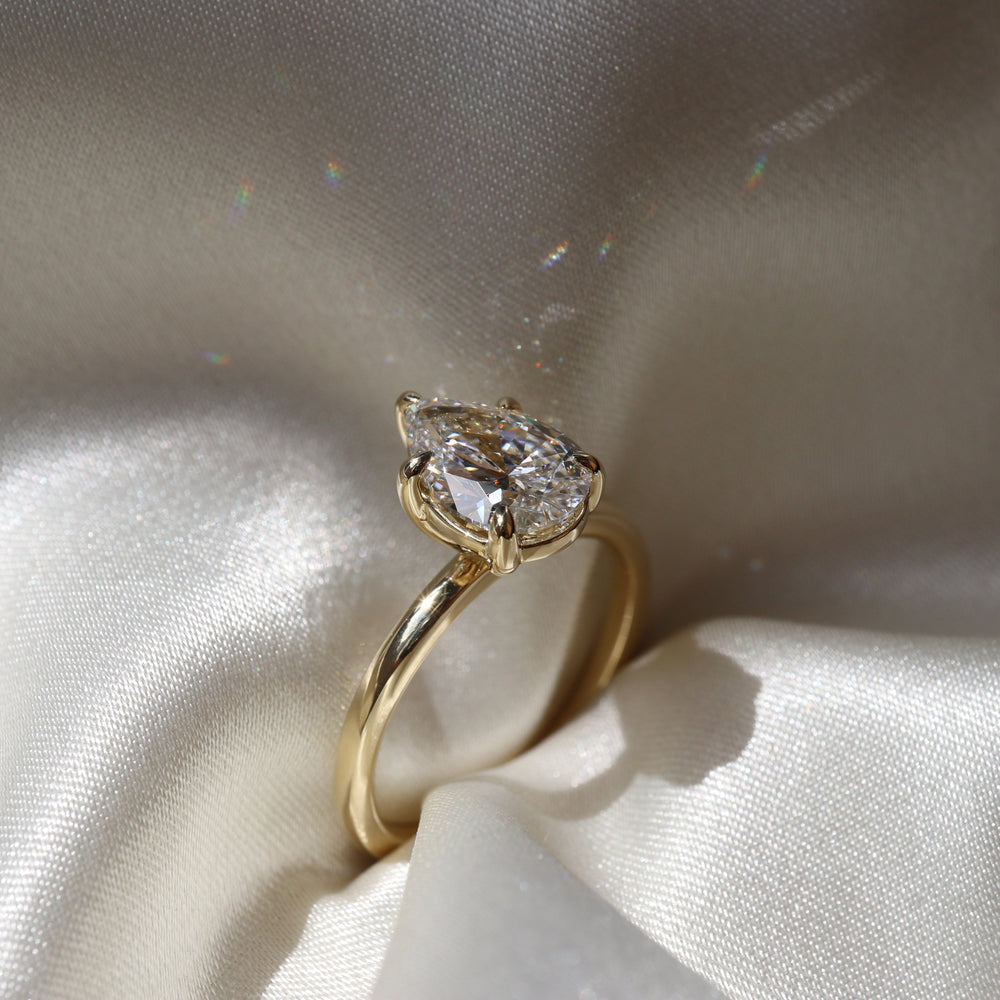 Elegant solitaire ring with pear-shaped moissanite center stone