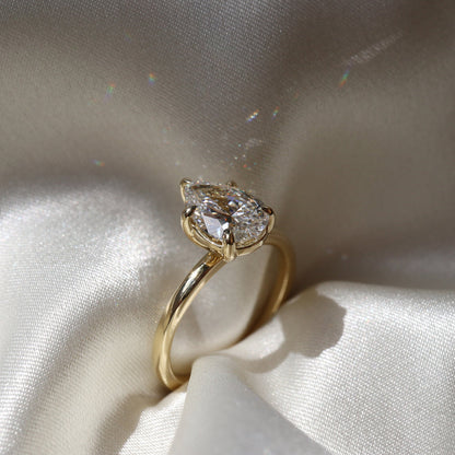 Elegant solitaire ring with pear-shaped moissanite center stone